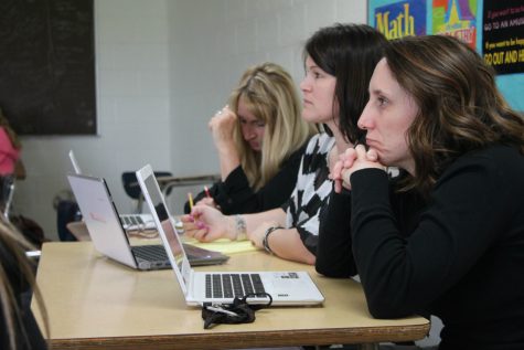 Judging the inventions presented before them, teachers Elizabeth Cyr, Jennifer Leuneberg and Kim Killinger determine which company is a wise investment.