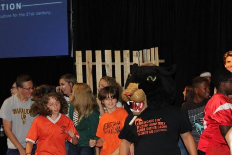 Getting down on the dance floor, sophomore Gabriel Millen, the panther mascot, represents Stockbridge High School at the Mike Smith Conference by showing off his moves in the dance competition held at the beginning of the event. 