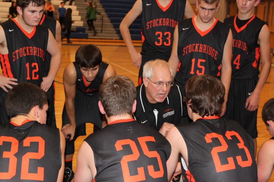 GAME TIME. Head coach Randy Swoverland directs his team during timeout during the December 9 game at Bath High School. The Panthers defeated the Bees 50-56.