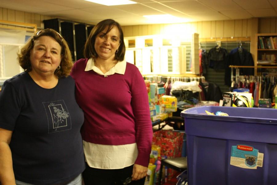 Working extra diligently during the busy holiday season, Stockbridge Community Outreach program director Karen Smith and volunteer Penny Kunzelman organize donations and attempt to provide much needed support and holiday cheer to families in need.