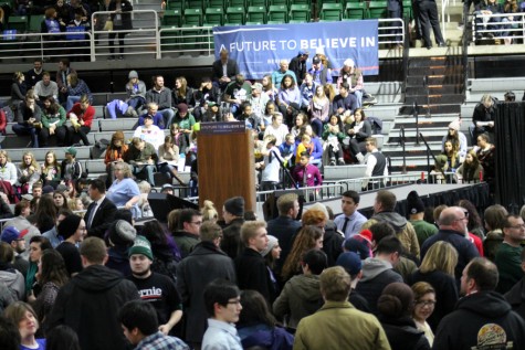 Barney and Kightlinger sat in the press box. Since they were press, they got access to the whole arena and could go down to ground level, where the podium was set up for Sanders to speak.