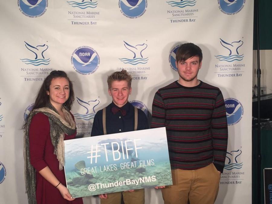Having won first place, sophomore Kelly Cool and juniors Jake Chapman and Sam Nichols are handed their award to commemorate their films high achievement at the Thunder Bay Film Festival. I was really happy to be there and be able to experience the festival as a whole, Nichols said.