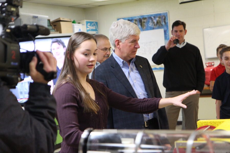 At the robotics tour in January 18, junior Madison Howard demonstrates the underwater ROVs which have been used in the discovery of airplane and ship wrecks in Lake Michigan and the Republic of  Palau in the Pacific Ocean.