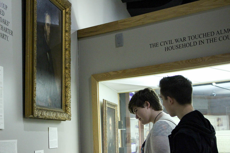 While reading information about the different objects in the history exhibit at Ella Sharp Art and History Museum of Jackson, sophomores Alexia Tanner and Shane Adam stalk and laugh about the descriptions of the art pieces. Photo Cheyenne Strong