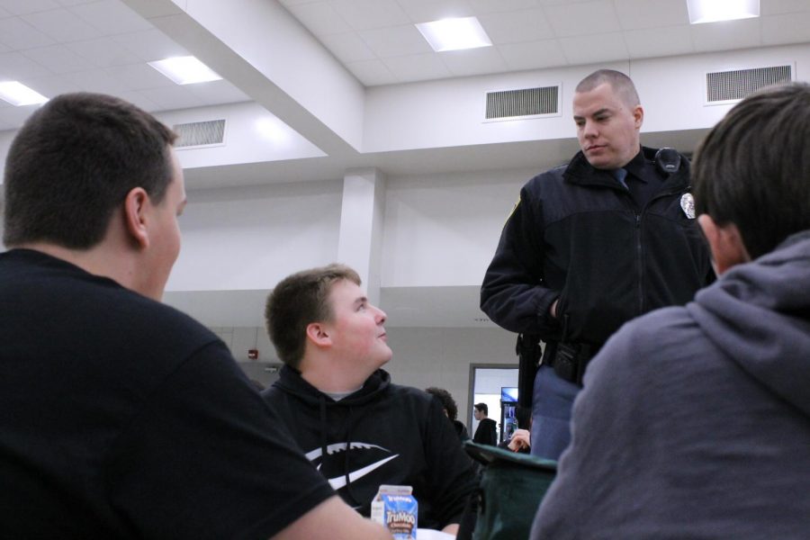 Engaging with students at lunch, Resource Officer Brad Hagman engages with Students at Lunch. Hagman hopes to take on a mentor role to the students and be someone they can talk to.