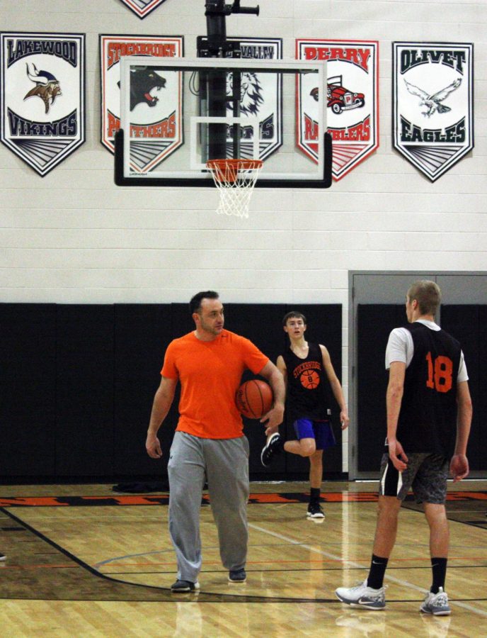 During a December practice, varsity coach Jacob Robidou runs a drill as juniors John Morris and Brandon Nelson wait for instructions. My goals for our team on one level is to get better throughout the year, Robidou said. I think we are in the top three and, definitely, should be in the running to win the district. A couple of wins and we will start the challenge for that.