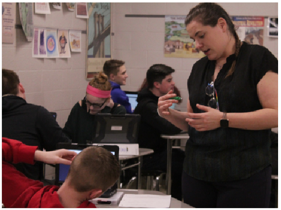 Explaining a U.S. history assignment about the western frontier exhibited through political cartoons, teacher Kathleen Riley uses guided teaching as her methodology to assist students.