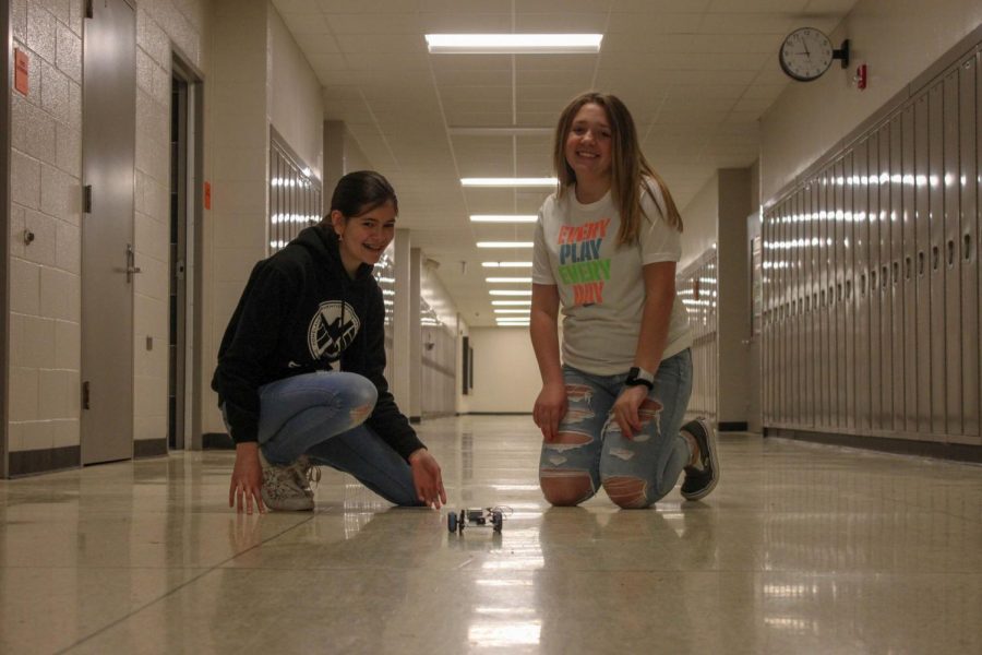 Happiness. While working on a robotics project, eighth graders Emily VanPelt and Kenzie Dalton express happiness when told they will get out of school a day early.