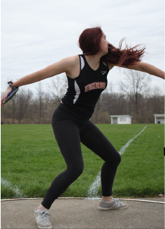 Practicing discus, Sophomore Carissa Heinzman tries to perfect her double spin, after over coming the obstacles after extensive foot surgery. She excels and has broken personal records thus far this season.