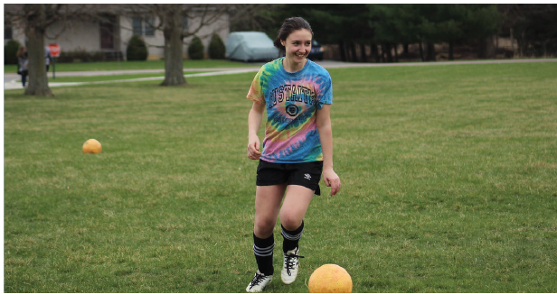 Sophomore Malena Rosedale practices shooting goals and dribbling in the practice soccer field for her upcoming soccer game. Communicating with other teammates with a smile and building up to kick for a clean pass. My goal is not about winning to build a better program so that when we are seniors it will be a thing others want to do. Rosedale said. 