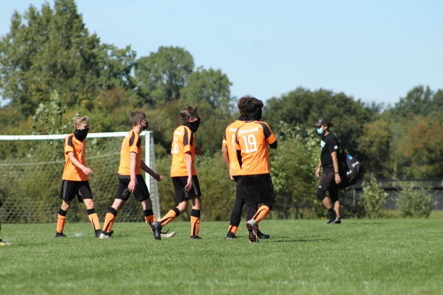 In Michigan, MHSAA’s new pandemic regulations on sports have affected many athletes. As of June 2, athletes are forced to wear masks during their games, and many other sport specific rules were put in place. (Pictured from left to right, Jonah Huskey-Wright, Jacob Olson, Jordan Huskey-Wright, Isaac Lance and Carson Oversmith).