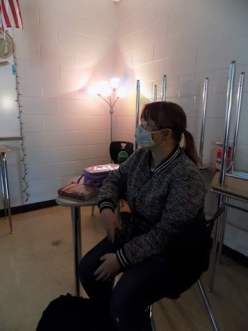 In her creative writing class, Kathryn Brumm, 10, wears her mask and follows the social distancing guidelines while listening to her teacher, Jessica Martell. “I’m excited to be back in the classroom, I just hope this all goes away soon.”