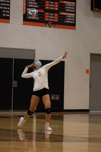 Sophomore outside hitter Gracee Robidou serves the ball in the Stockbridge Panthers first win against Quincy. They ended the night with a close win going into all five sets. 