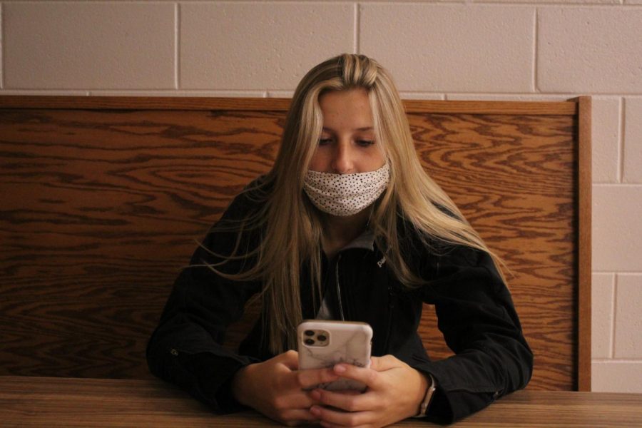 PHOTO: GWEN ROGOZINSKI Junior Kayla Surline uses her phone. I use social media almost all day, said junior Jolie Smith, Most people use it a lot.