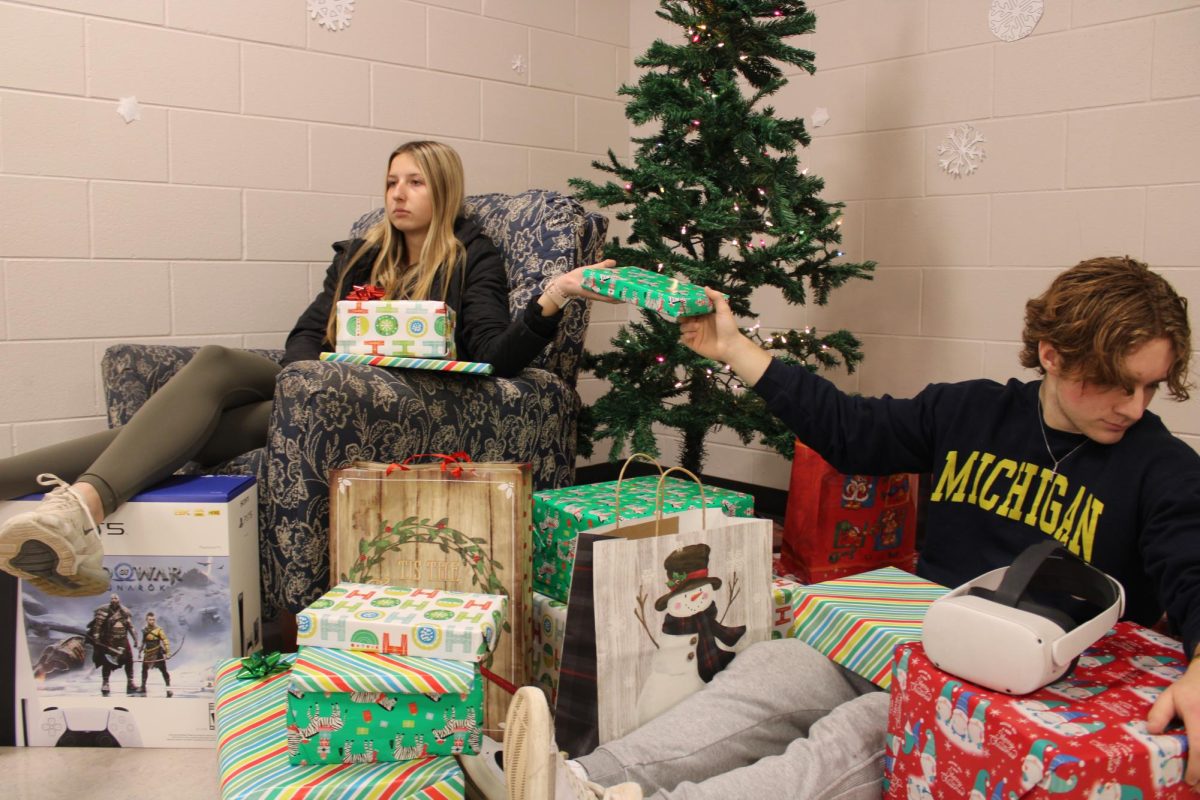 Opening presents without family just doesnt seem like Christmas to seniors Jack McLennan and Kayla Surline.