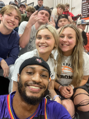 Students with a Harlem Wizards player