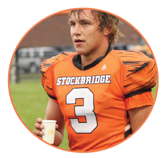 Zac Rogozinski takes a water break during a hard play.