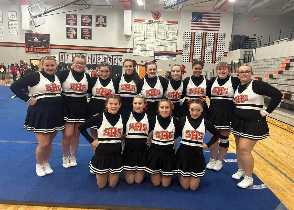 The girls varsity cheer team pose for a photo after 2nd place win.