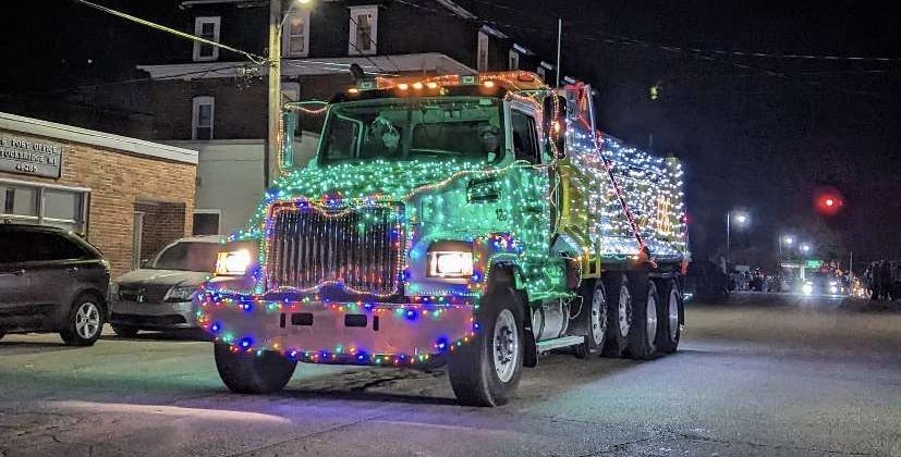 As Christmas lights illuminate the streets, Gustafson Excavating takes the cake with a commercial truck decked out in green and blue bulbs.