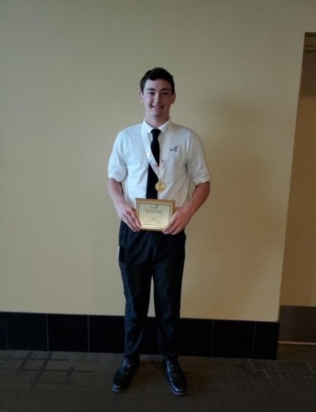 Senior Zach Fletcher holds his first place plaque in Plumbing won from the State Leadership and Skills Conference.  Photo provided by Wilson Talent Center Facebook page