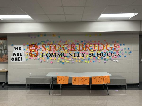 To encourage connectedness, Assistant Principal, Derek Douglas, encouraged staff members and students to put their name on a sticky note for the "We Are One" wall.